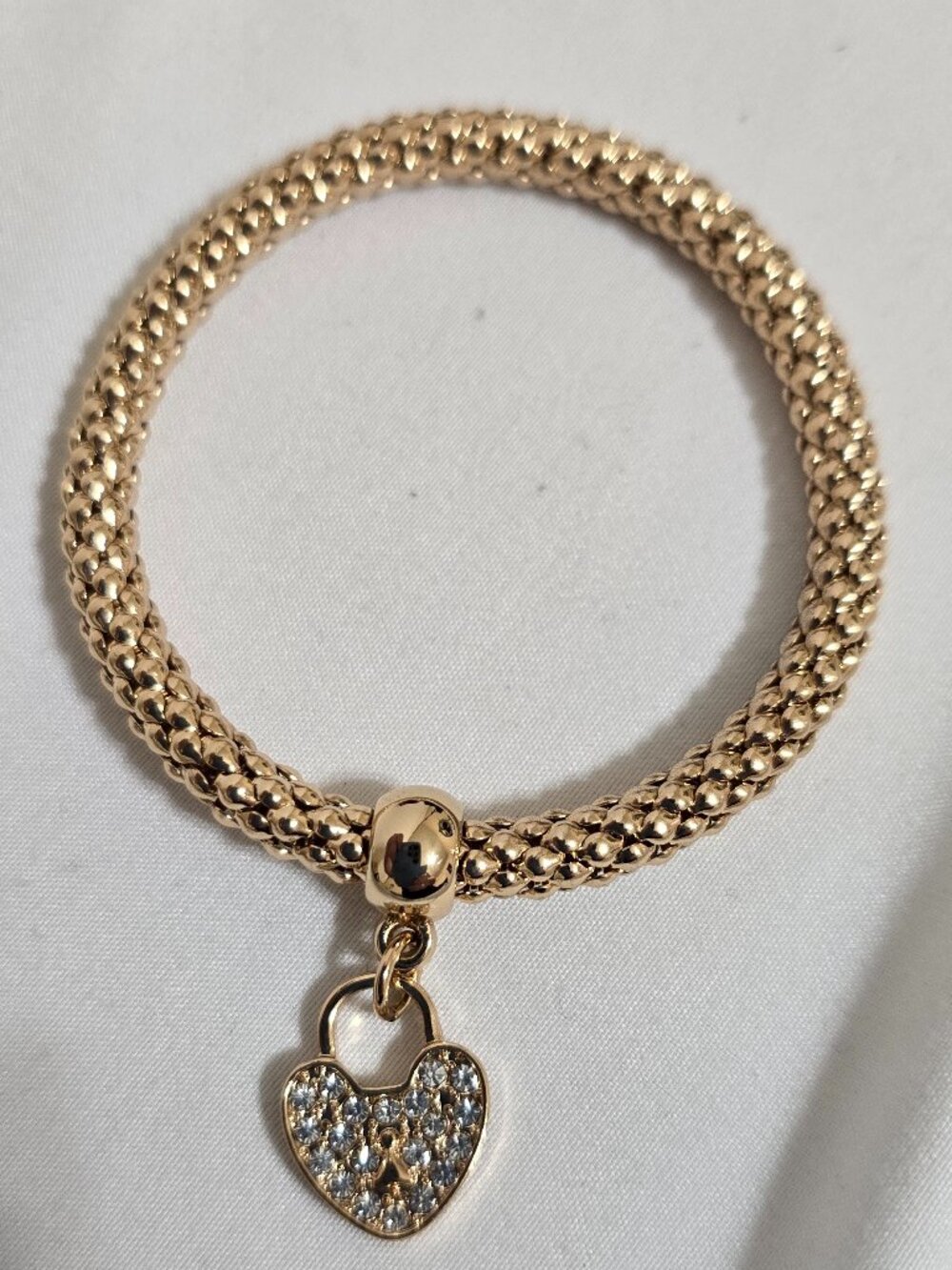 Gold-Tone Stretch Bracelet with Rhinestone Heart Charm